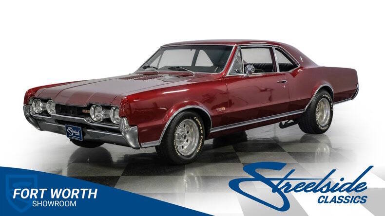 Oldsmobile-Cutlass-1967-Calypso-Red-Black