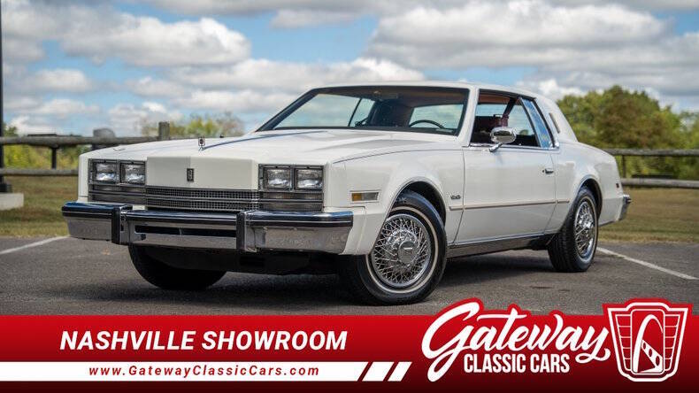 Oldsmobile-Toronado-1985-White-Burgundy